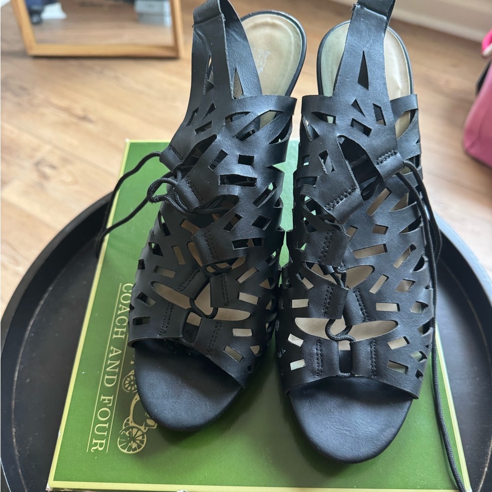 Coach and Four Black Gladiator Sandals with Lace-Up Design